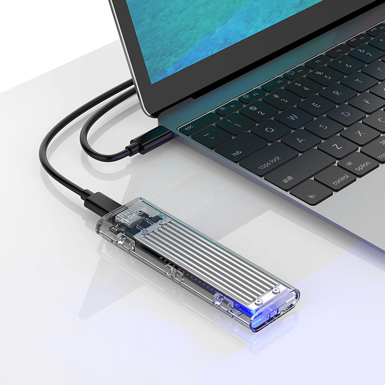 Kasë Orico TCM2-C3 për SSD M.2 NVME në USB-C 10Gb/s, Gri/Transparent