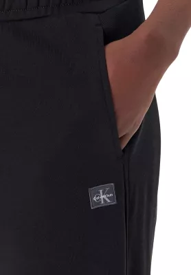 Pantallona sportive për femra Calvin Klein Jeans A-FRENCH TERRY BADG LV047C249G, të zeza [Madhësia: S]