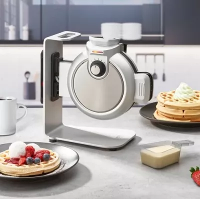 Aparat për vaflla CASO WaffleUp 2932 800 W, sistem vertikal, Ø18 cm, rregullim 5 nivele, me lugë dozimi + tabaka pikuese, argjendtë